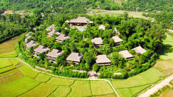 Immerse yourself in the peaceful surroundings of rice paddies and soaring mountains