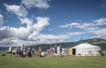 Group of people at a yurt camp