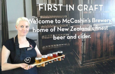 McCashin's Brewery sign with woman serving beer