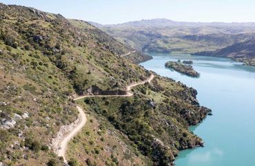 Trail in side of hill with water besides