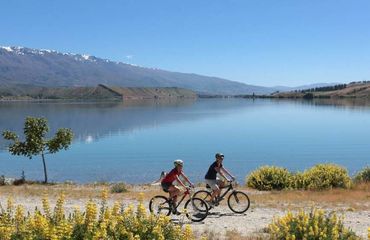 Cyclists on trail by the lake