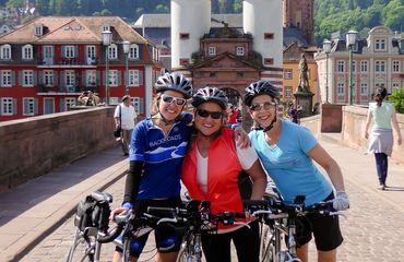 Cyclists with buildings in the background