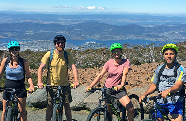 Group of cyclists on top of mountain