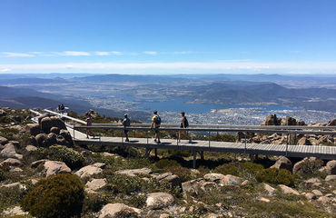 People on walkway at top of mountain