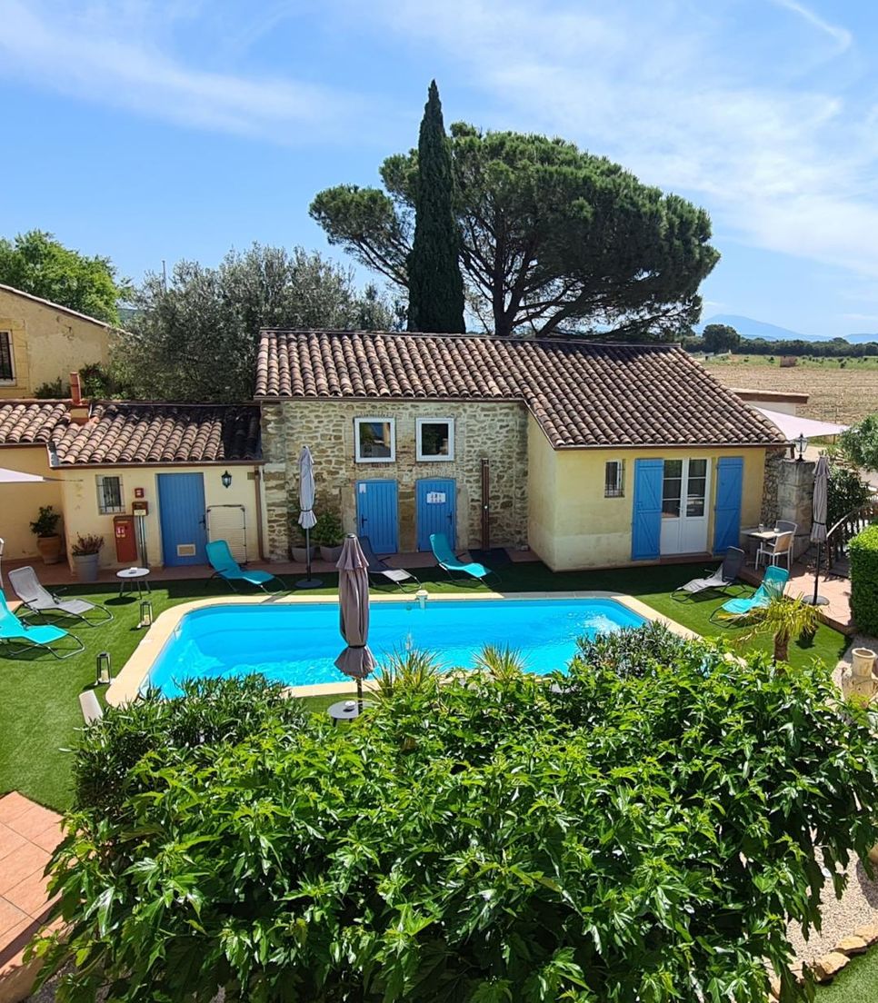Sleep in rustic Provençal-style rooms that's located in the heart of the vineyards and comes with an outdoor pool