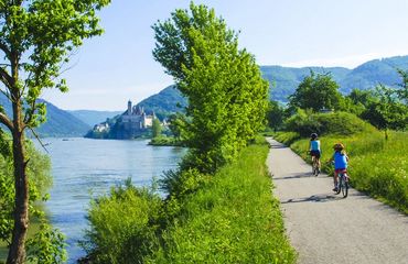 Children cycling beside the Danube