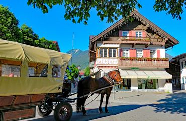 German building and horse with carriage