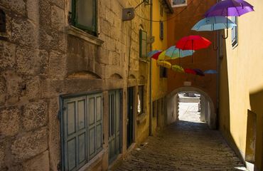 Alleyway with umbrellas