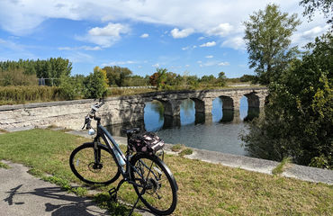 Bicycle in front of bridge