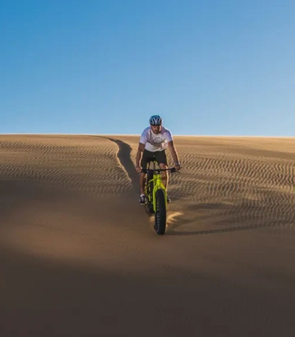 Cycle over sand dunes on fat bikes that have wider tyres