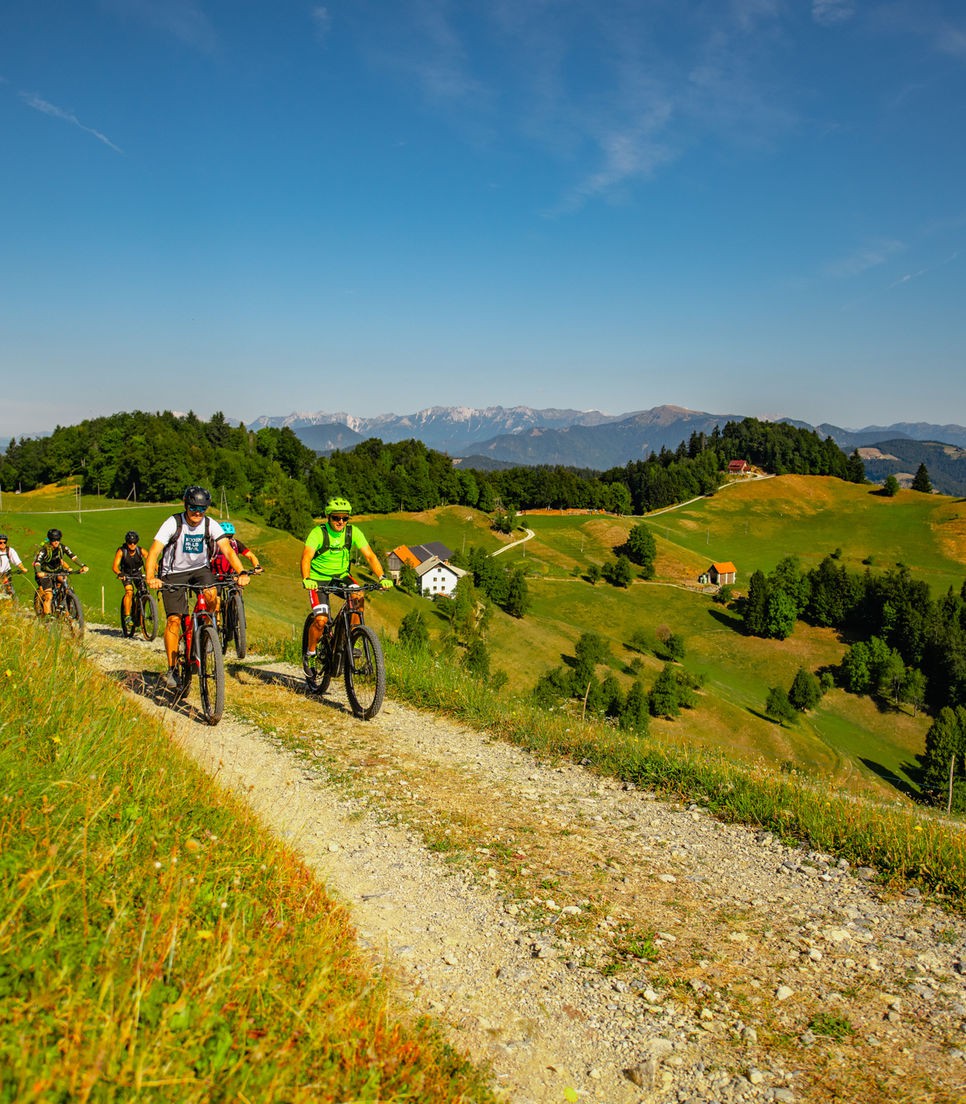 A bike tour in Slovenia takes you on a scenic journey through lush forests, charming villages, and rolling hills