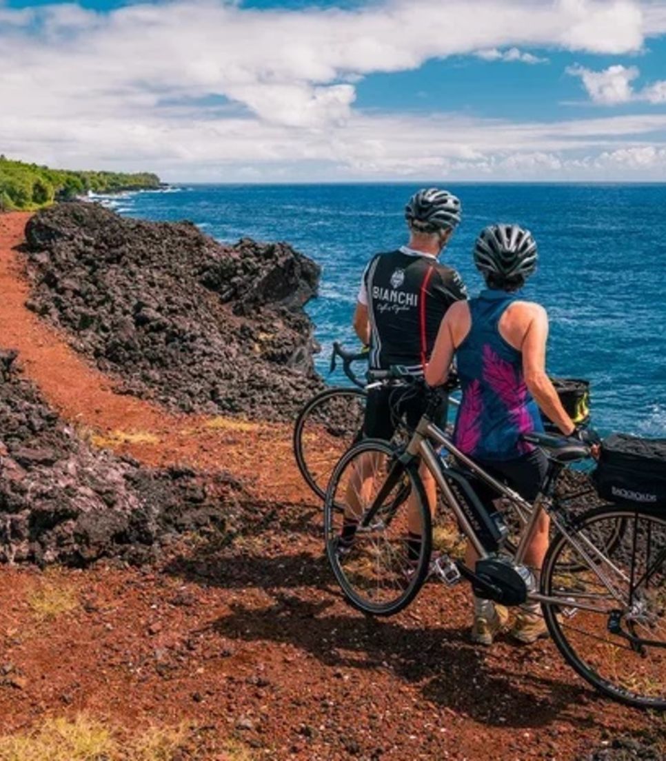 Enjoy the unspoiled beauty Hawaiian coasts, craters and rainforests on a guided bike tour