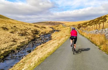 Cyclist on road in the countryside