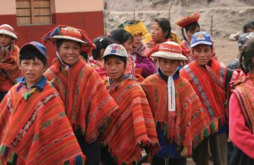 Group of children in red ponchos