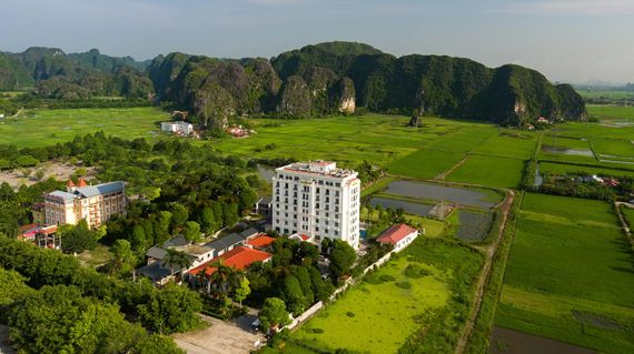 Wake up to impeccable views of rice fields from this luxurious property