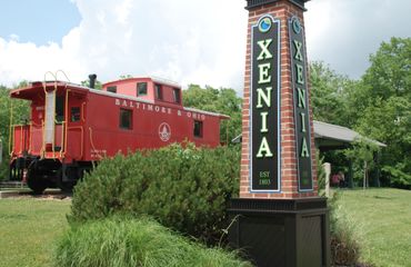 Xenia sign and old train carriage