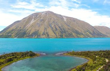 Vibrant blue lake and mountain