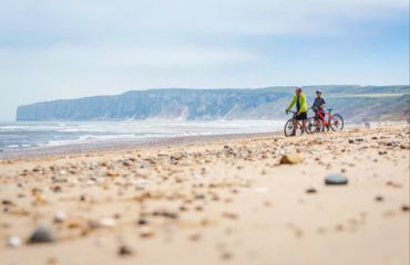 Cyclists on the beach