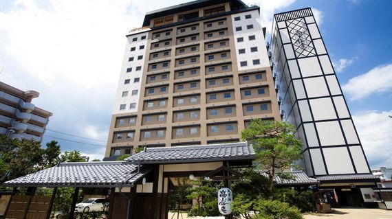 Savor the serene views from your Japanese hotel room, a perfect rest stop on this cycling journey