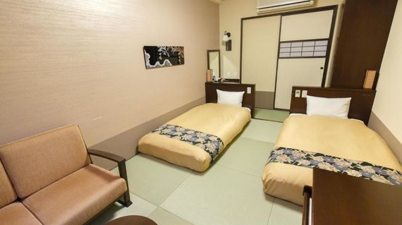 Savor the serene views from your Japanese hotel room, a perfect rest stop on this cycling journey