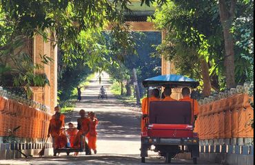 Monks in tuk tuks