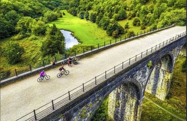 Cyclists riding on viaduct