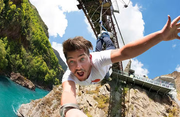 Person bungy jumping and taking a selfie