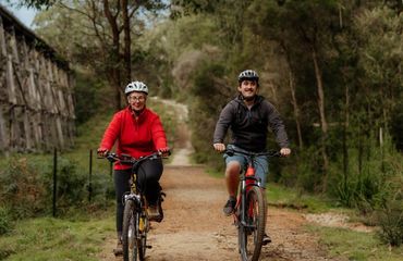 Woman and man riding bike