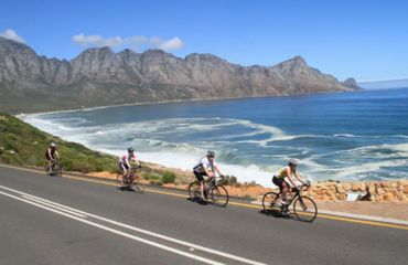 Road cycling by the sea and mountains