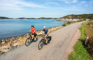 Cyclists on path by water