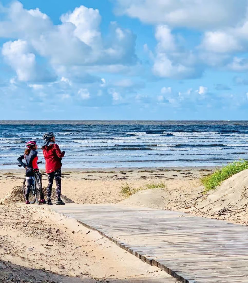 Get off the bikes to dip your toes in the sand