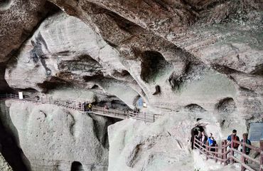 People in a cave on a walkway