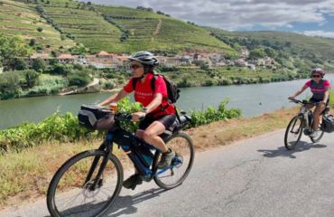 Cyclists on trail by river