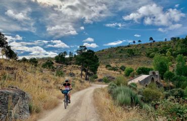 Cyclist on trail in the hills