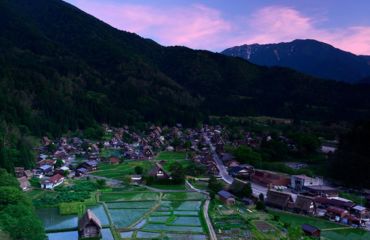 Rice paddies and traditional village in mountains