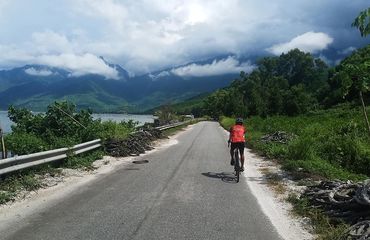 Person cycling alone on the road