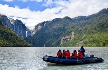 Hanging glacier and people in a boat