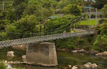 Cyclists riding across a bridge