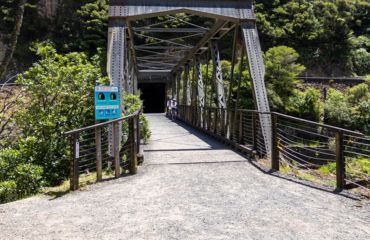 Entrance to a bridge with forested surrounds