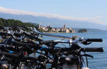 Close up of bikes with island in background