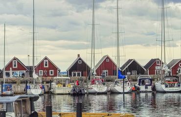 Marina with red a-framed buildings in a row