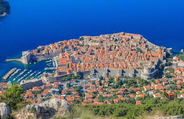 Panoramic shot of Dubrovnik - ancient walled city and the blue sea