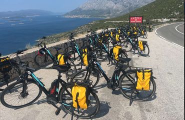 Bicycles lined up on stands overlooking ocean