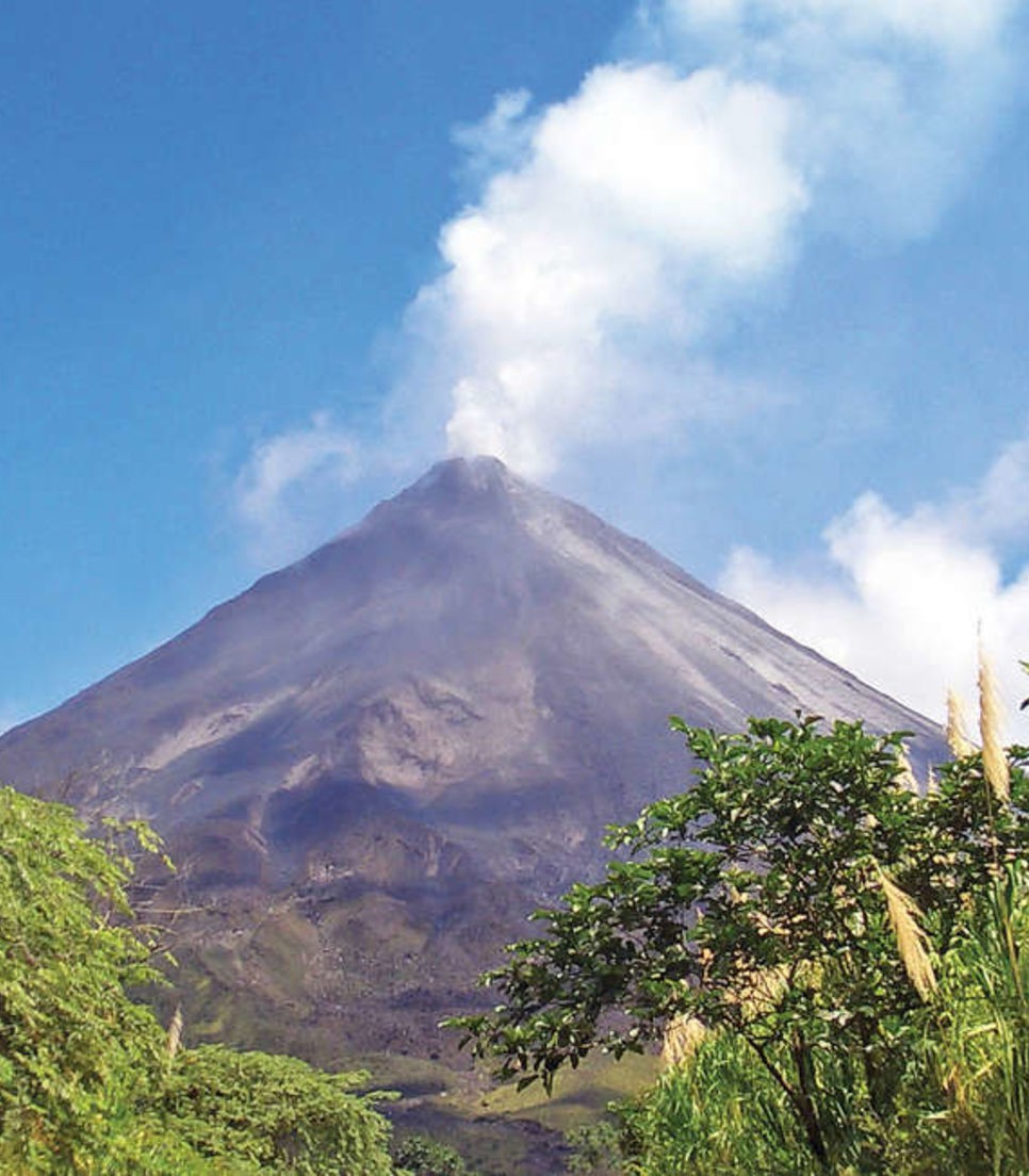 Soak in the awe-inspiring views cycling around this active volcano and lake