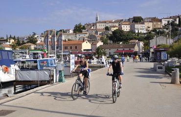 Cyclists by the boat dock