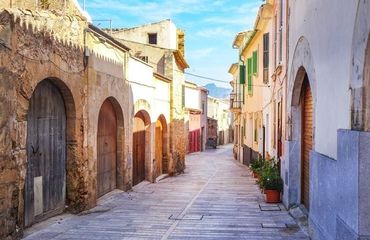 Narrow street with old buildings on each side