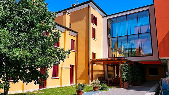 Spend your final night in a boutique hotel housed in a 19th-century building near the Mestre train station

