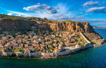 Coastal village nesled up at a mountain face