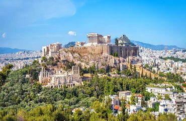 Ancient site on top of hill surrounded by city