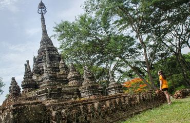 Woman standing infront of ancient structure